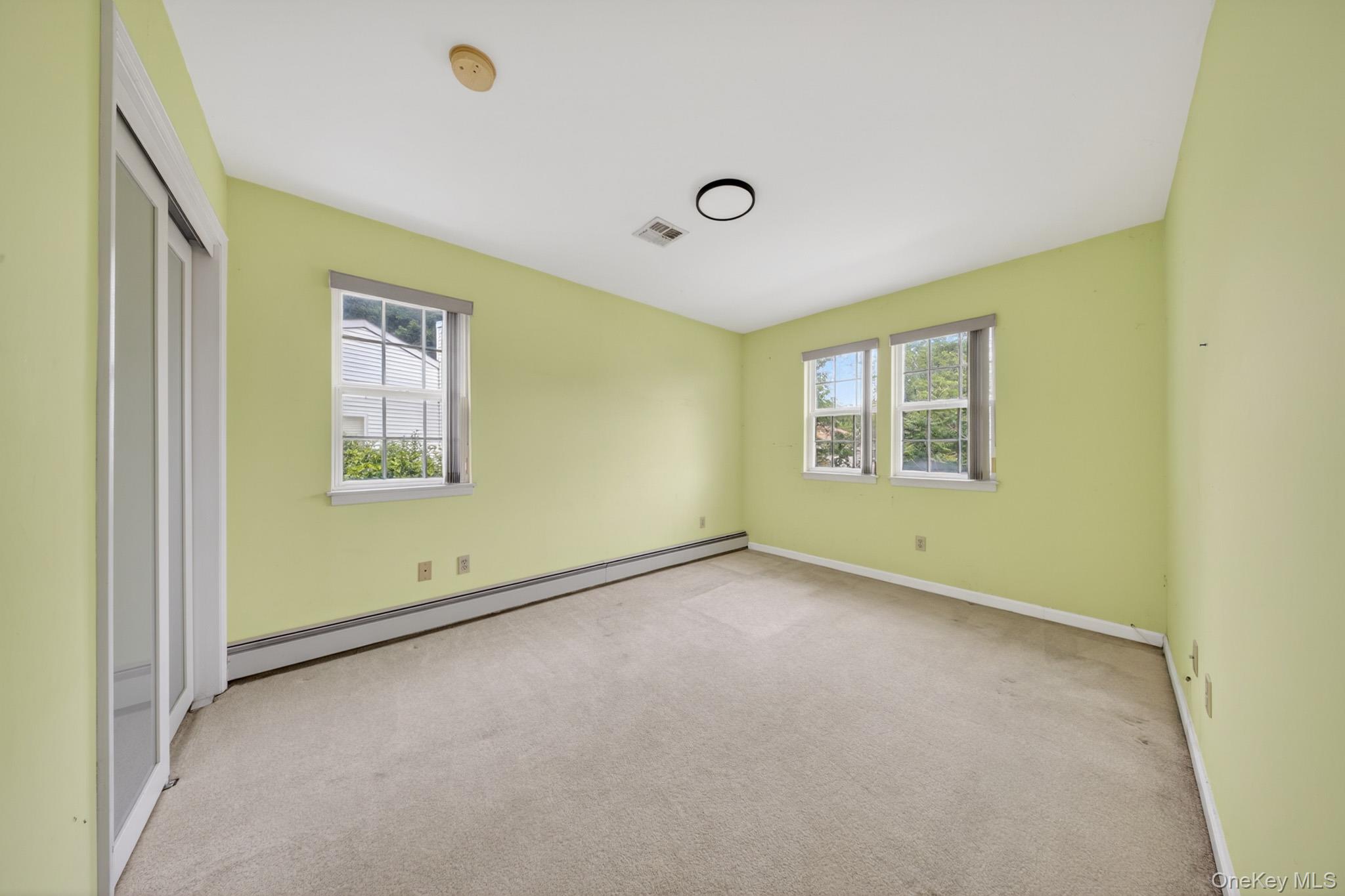 82 B Inwood Road Port Washington, NY 11050 - Photo 24 of 41 an empty room with a window