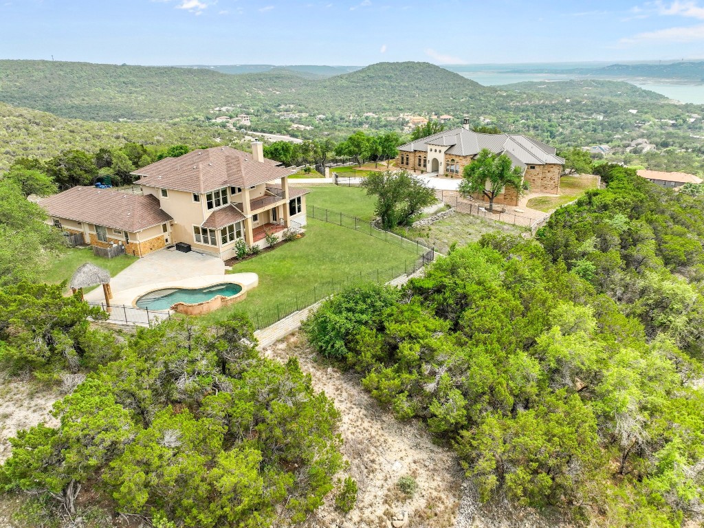 8293 Lime Creek Road Leander, TX 78641 - Photo 1 of 39 an aerial view of residential houses with outdoor space and ocean view