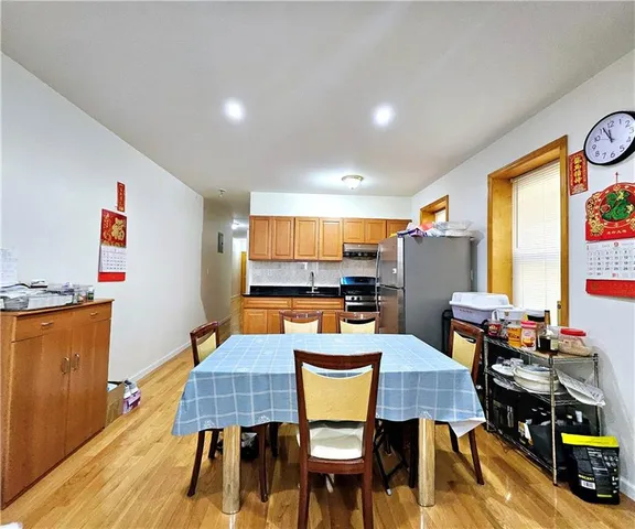 a dining room with furniture and wooden floor