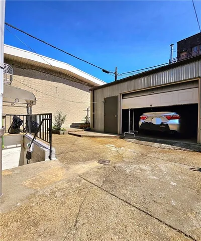 a view of a brick building with many windows