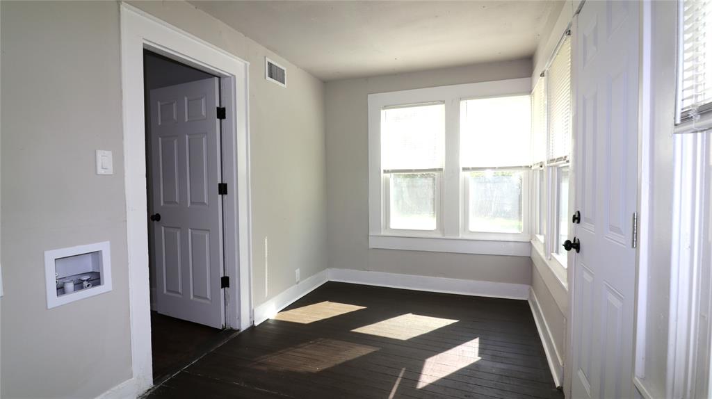 929 Vitalious Street Ranger, TX 76470 - Photo 19 of 22 Empty room with baseboards and dark wood finished floors