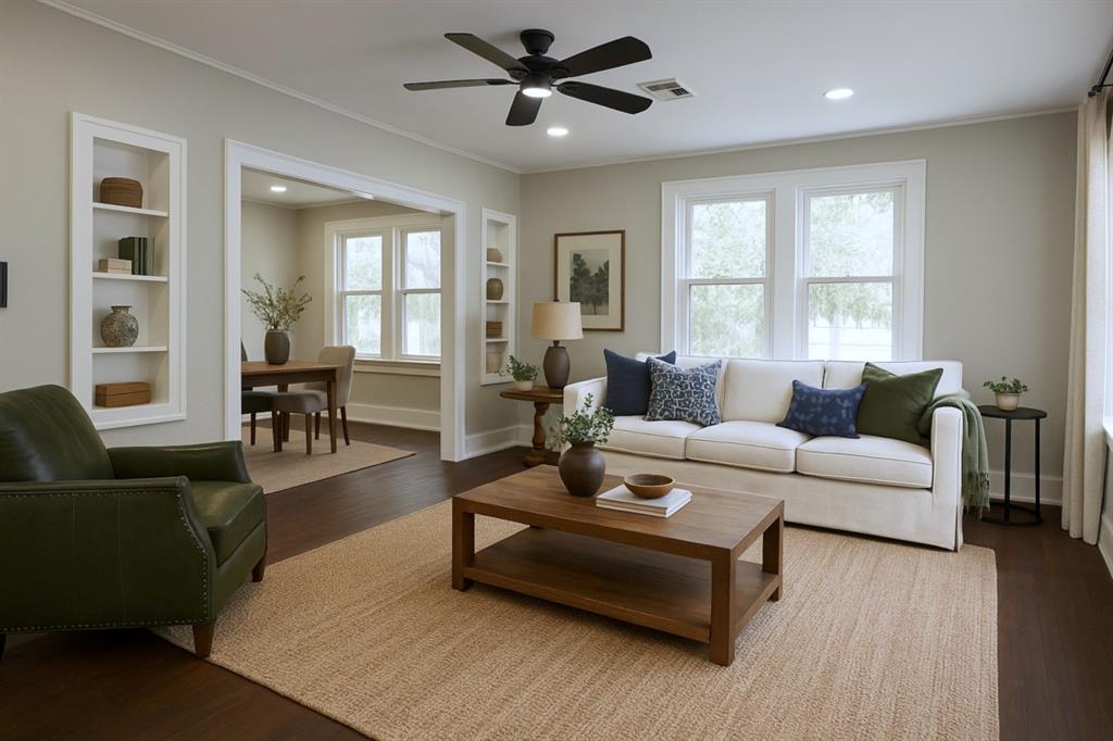 929 Vitalious Street Ranger, TX 76470 - Photo 4 of 22 Living area featuring built in shelves, wood finished floors, ornamental molding, recessed lighting, and a ceiling fan