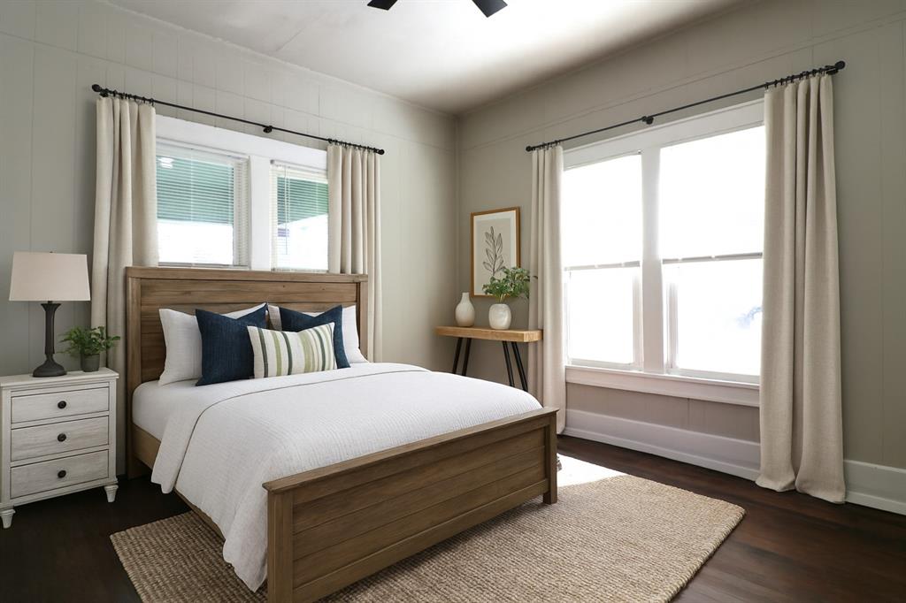 929 Vitalious Street Ranger, TX 76470 - Photo 10 of 22 Bedroom with dark wood-style floors, multiple windows, and ceiling fan