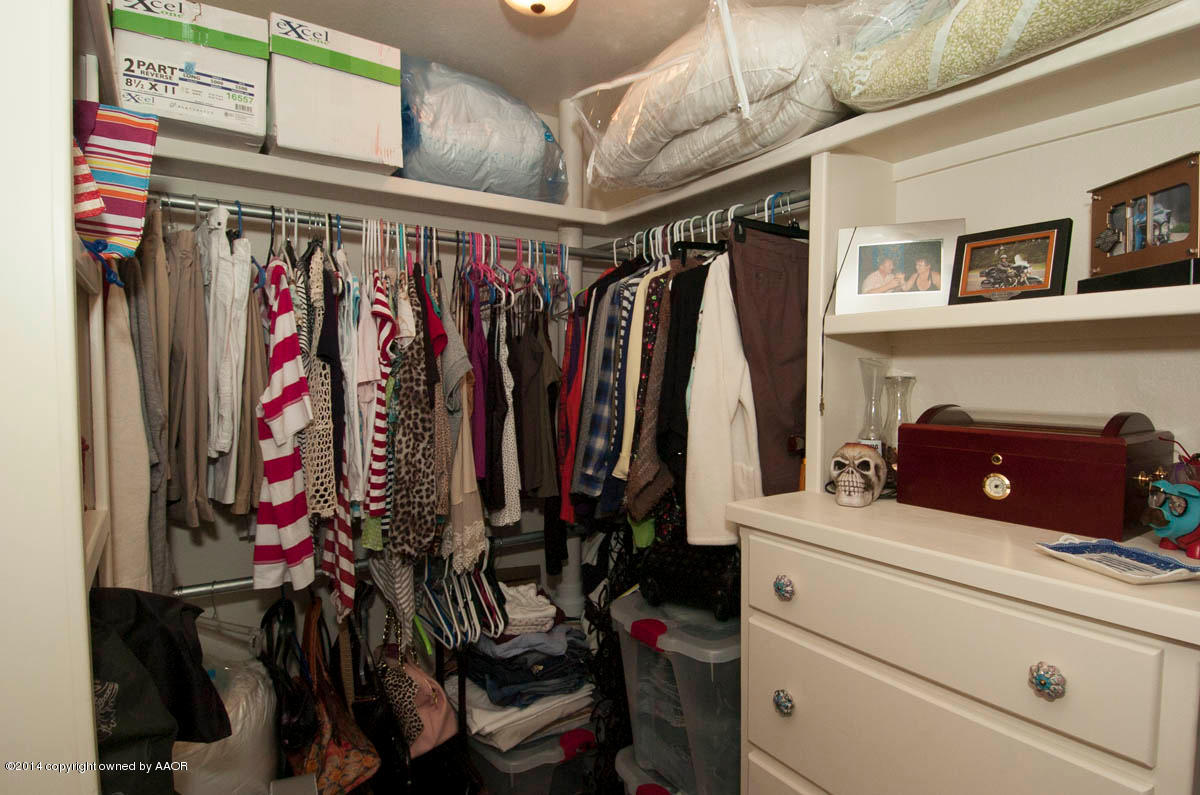 18301 Copper Ridge Bushland, TX 79124 - Photo 16 of 38 a view of walk in closet with clothes