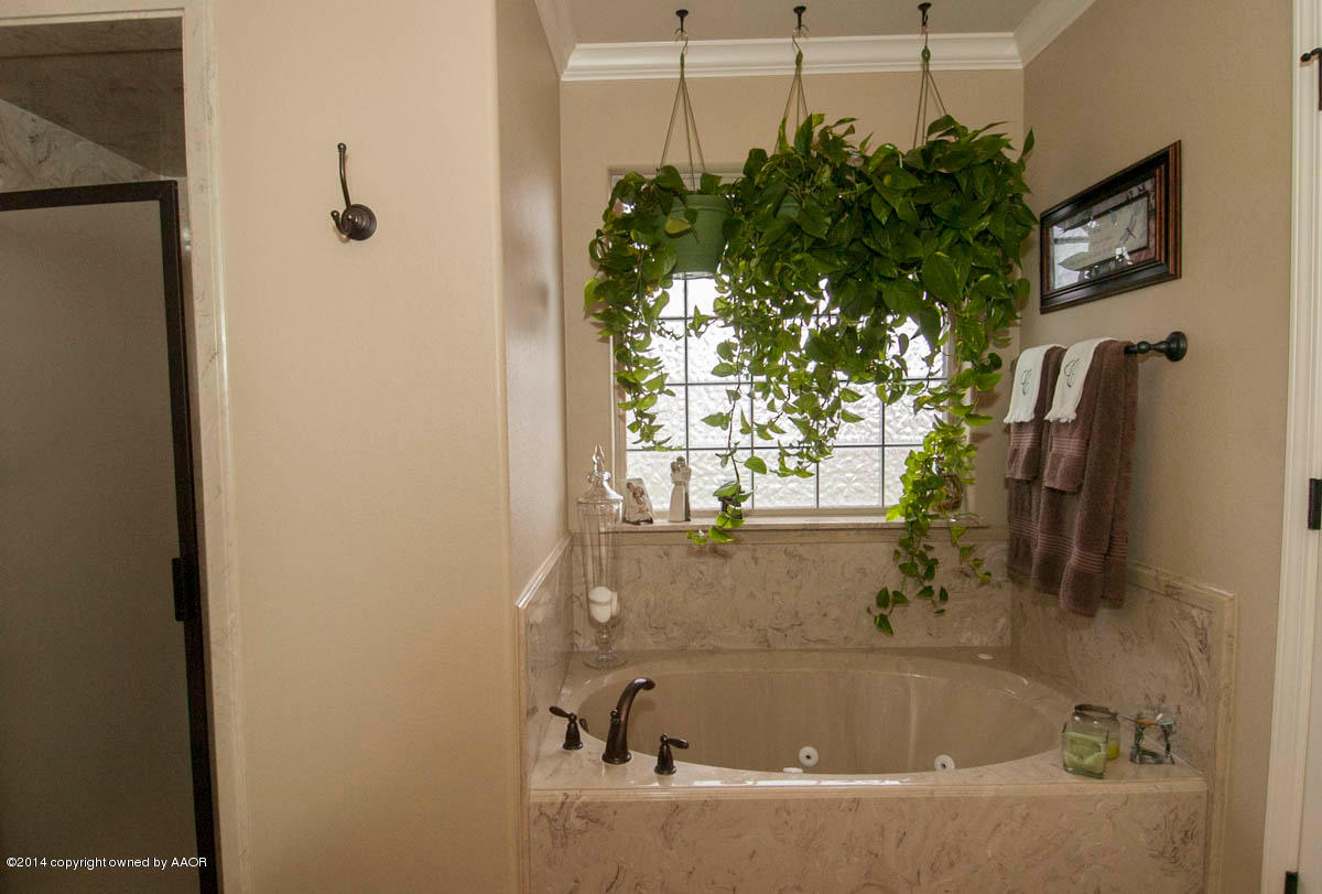 18301 Copper Ridge Bushland, TX 79124 - Photo 19 of 38 a bathroom with a bathtub