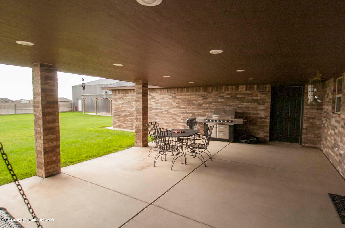 18301 Copper Ridge Bushland, TX 79124 - Photo 31 of 38 a view of a patio with a table and chairs with wooden floor and fence