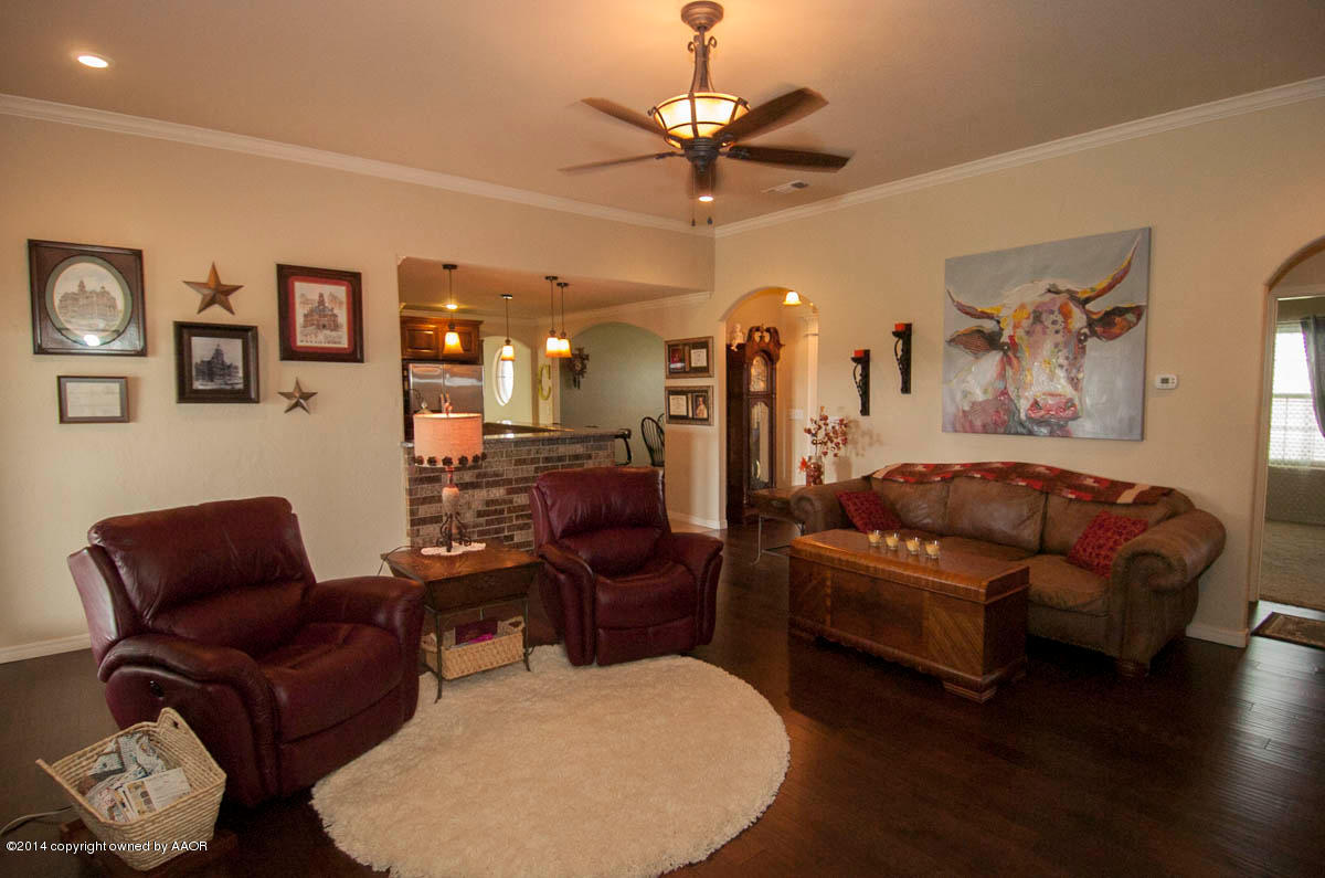 18301 Copper Ridge Bushland, TX 79124 - Photo 4 of 38 a living room with furniture ceiling fan and a rug