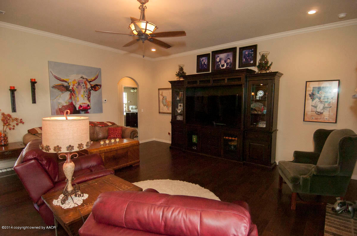 18301 Copper Ridge Bushland, TX 79124 - Photo 5 of 38 a living room with furniture and a flat screen tv