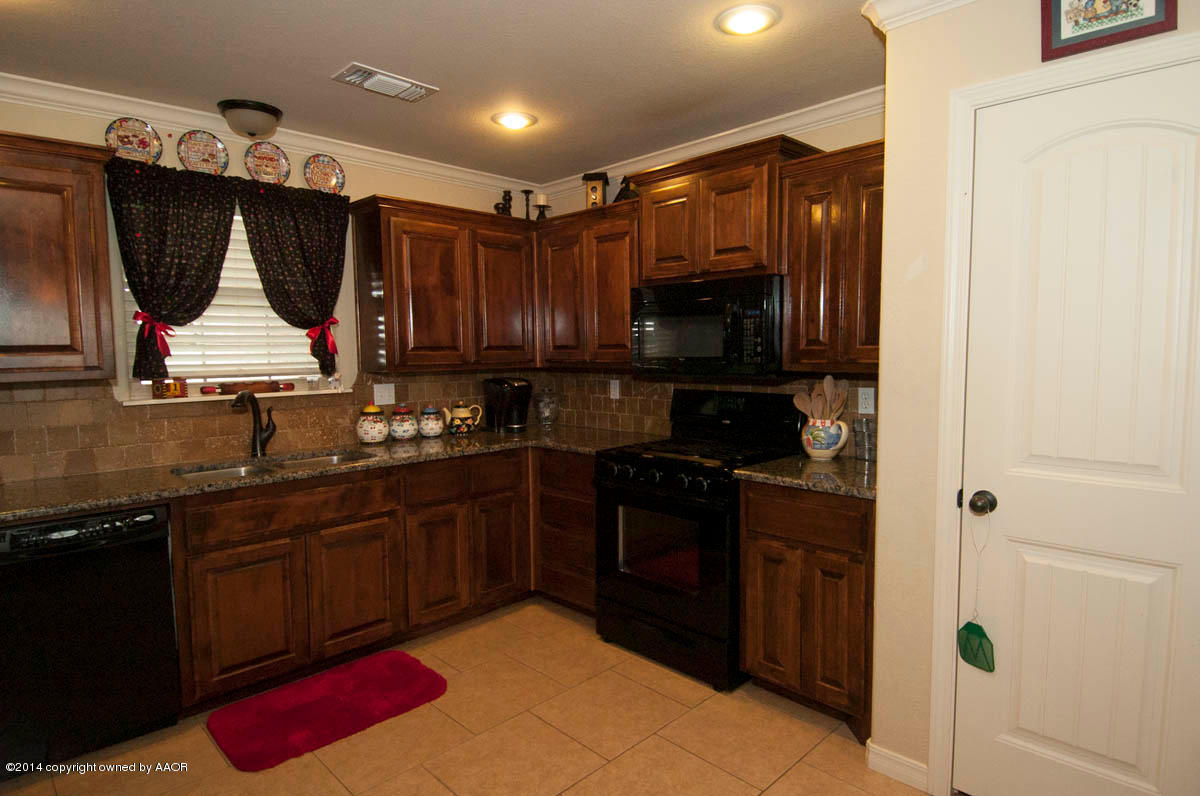 18301 Copper Ridge Bushland, TX 79124 - Photo 8 of 38 a kitchen with a sink and a stove