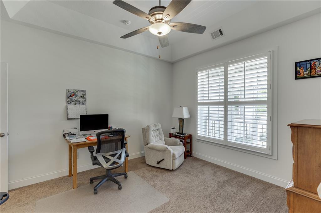 7660 Fern Lane Lula, GA 30554 - Photo 7 of 50 a view of a workspace with furniture and a window