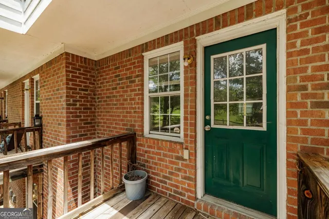 a view of a hallway with a wooden floor