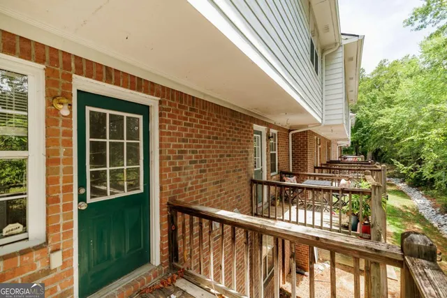 a view of a brick house with a large window