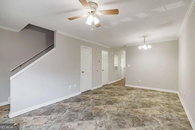 a kitchen with cabinets appliances a sink and a stove