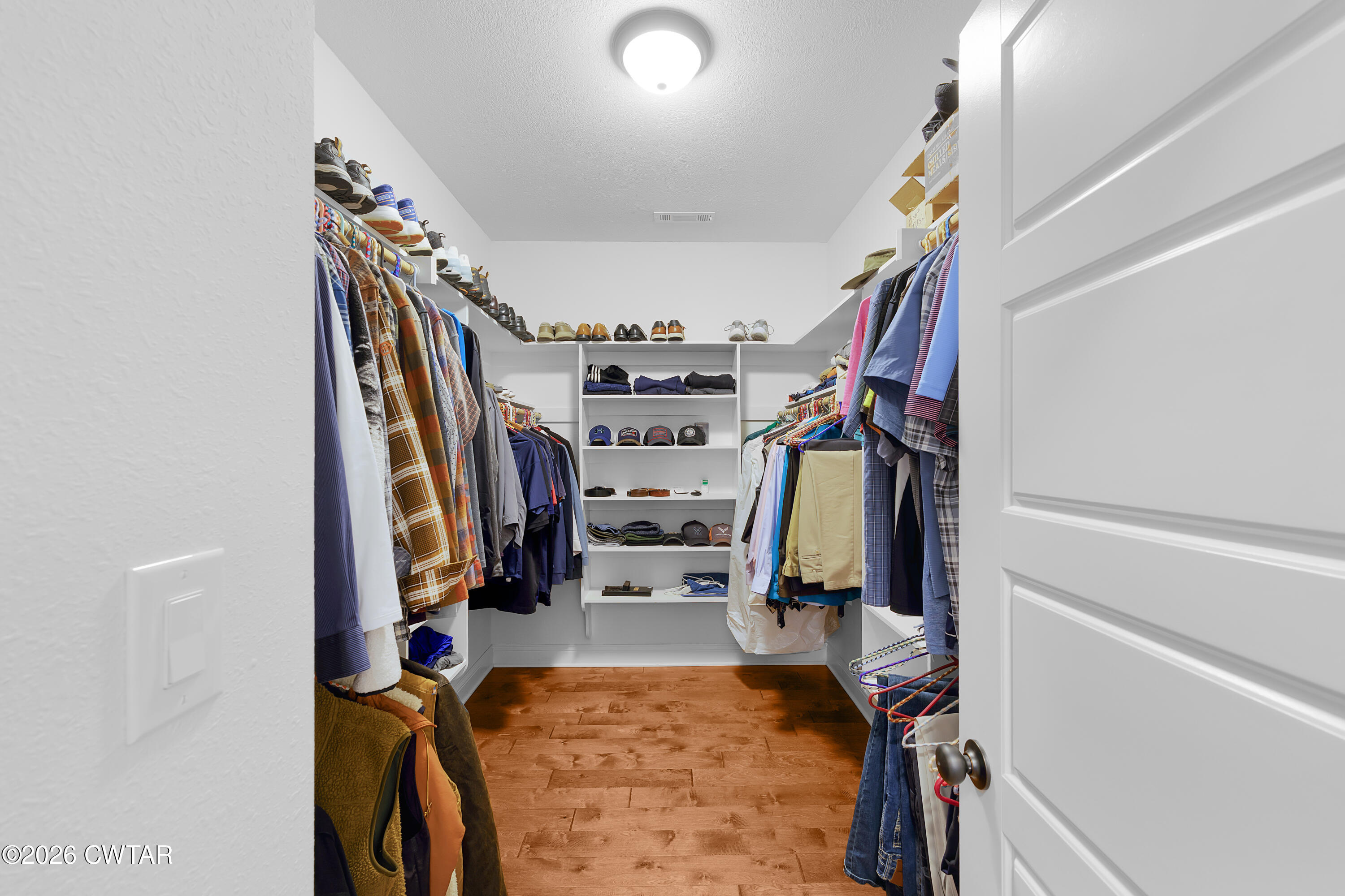 34 Cheddleton Cove Jackson, TN 38305 - Photo 12 of 32 a view of walk in closet with clothes and shoes