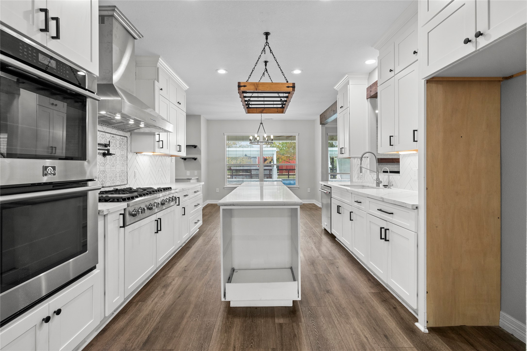 2730 Lawrence Road Kemah, TX 77565 - Photo 10 of 48 a kitchen with stainless steel appliances a stove a sink and a refrigerator