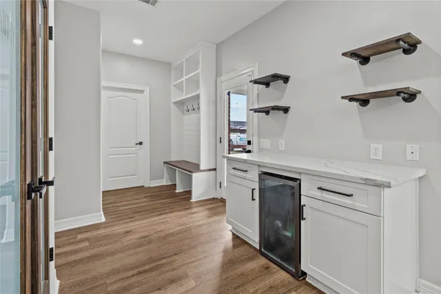 a kitchen with stainless steel appliances a stove a sink and a refrigerator