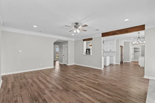 a kitchen with stainless steel appliances granite countertop a stove oven and a white refrigerator