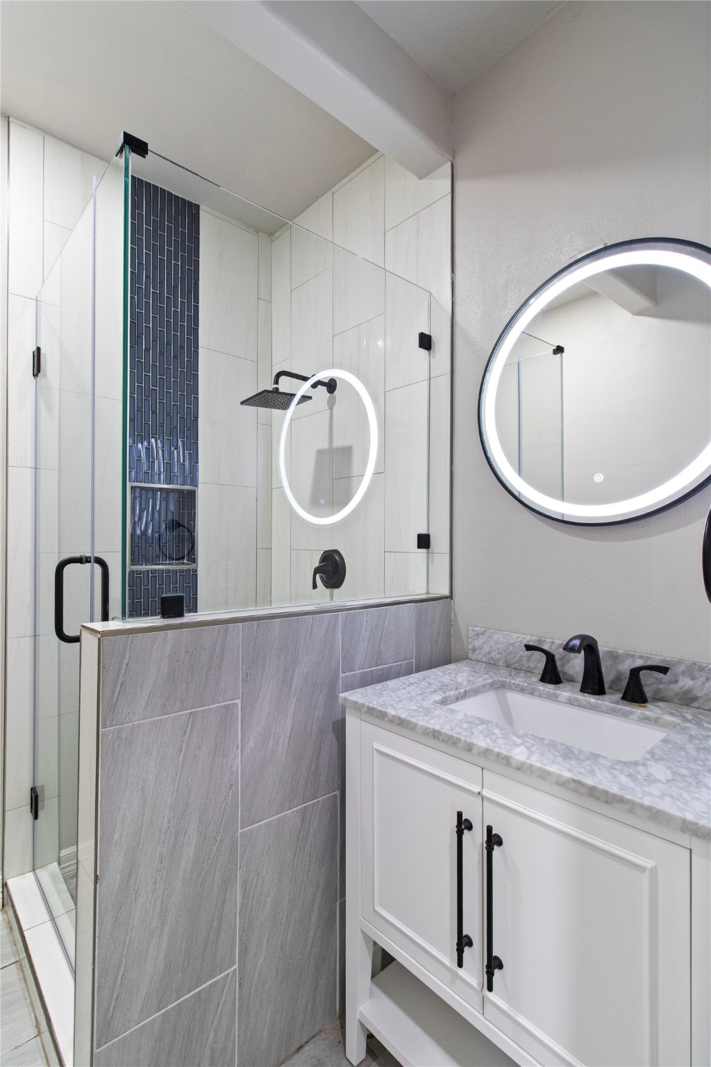 2730 Lawrence Road Kemah, TX 77565 - Photo 15 of 48 a bathroom with a granite countertop sink a mirror and shower