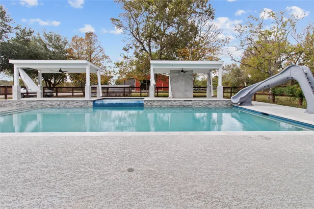 swimming pool view with a outdoor space