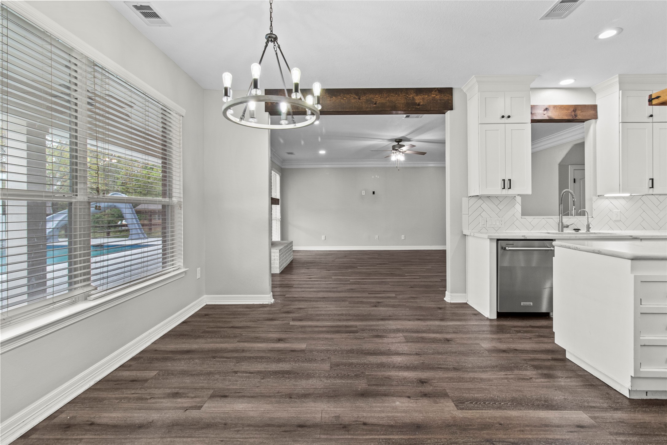 2730 Lawrence Road Kemah, TX 77565 - Photo 23 of 48 a view of kitchen with granite countertop cabinets a sink and stainless steel appliances