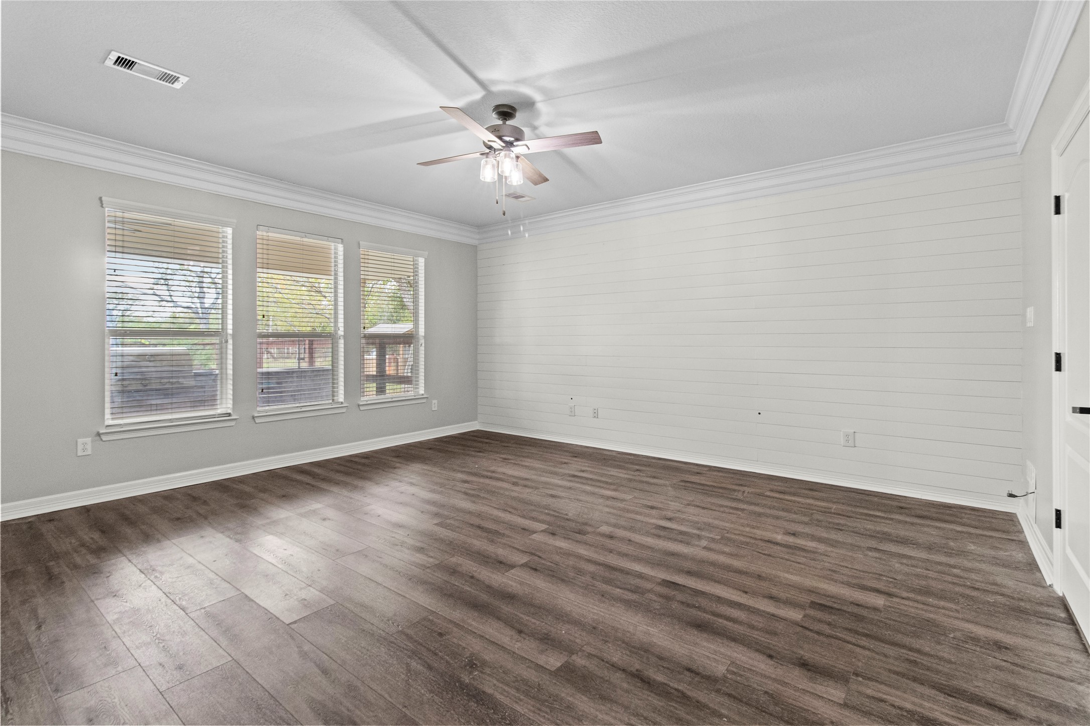 2730 Lawrence Road Kemah, TX 77565 - Photo 24 of 48 a view of an empty room with wooden floor and a window
