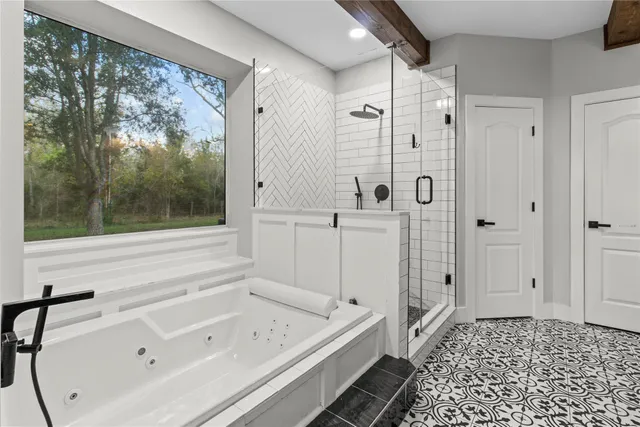 an empty room with wooden floor and ceiling fan