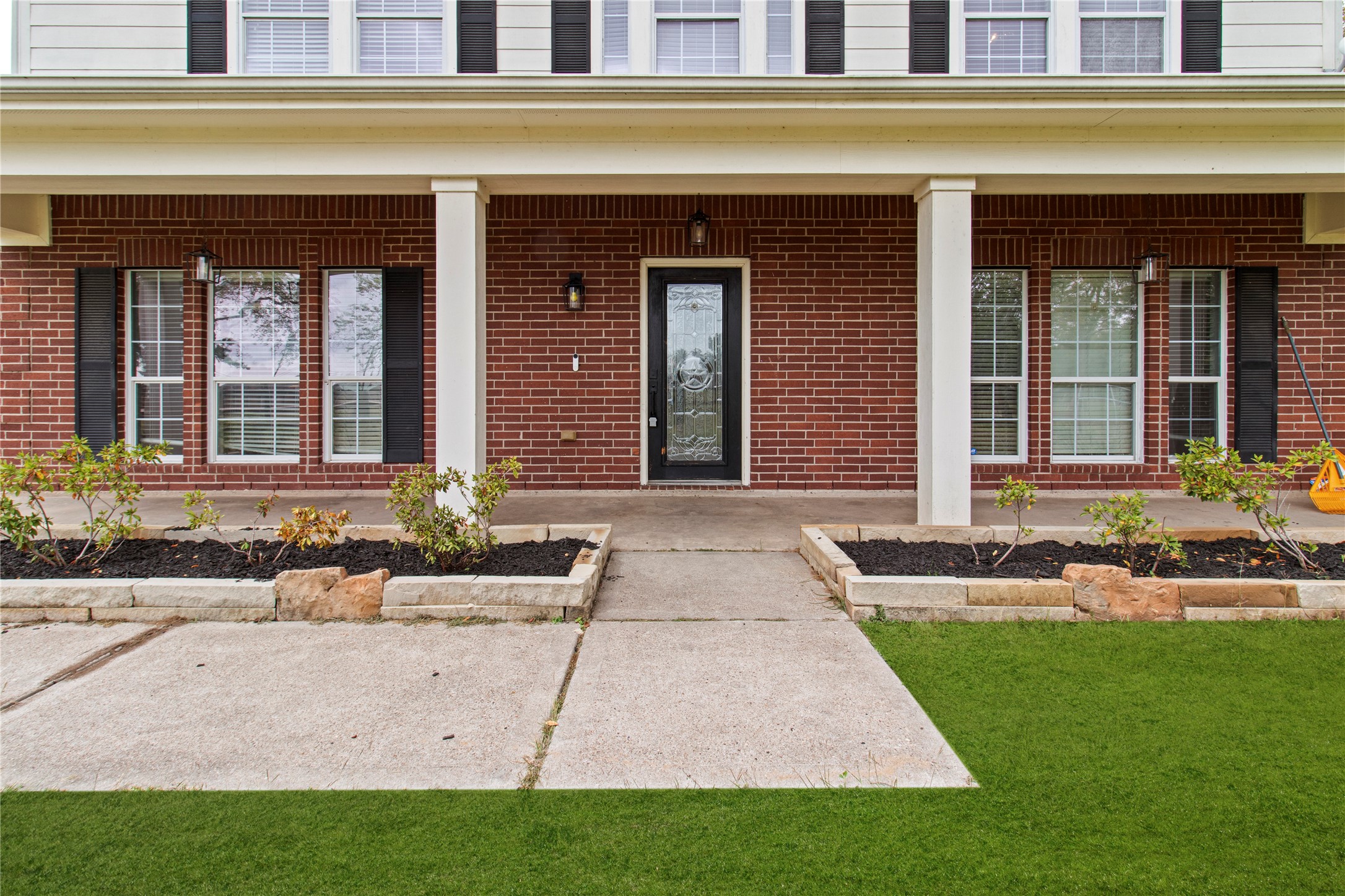 2730 Lawrence Road Kemah, TX 77565 - Photo 3 of 48 a front view of a brick house with a yard