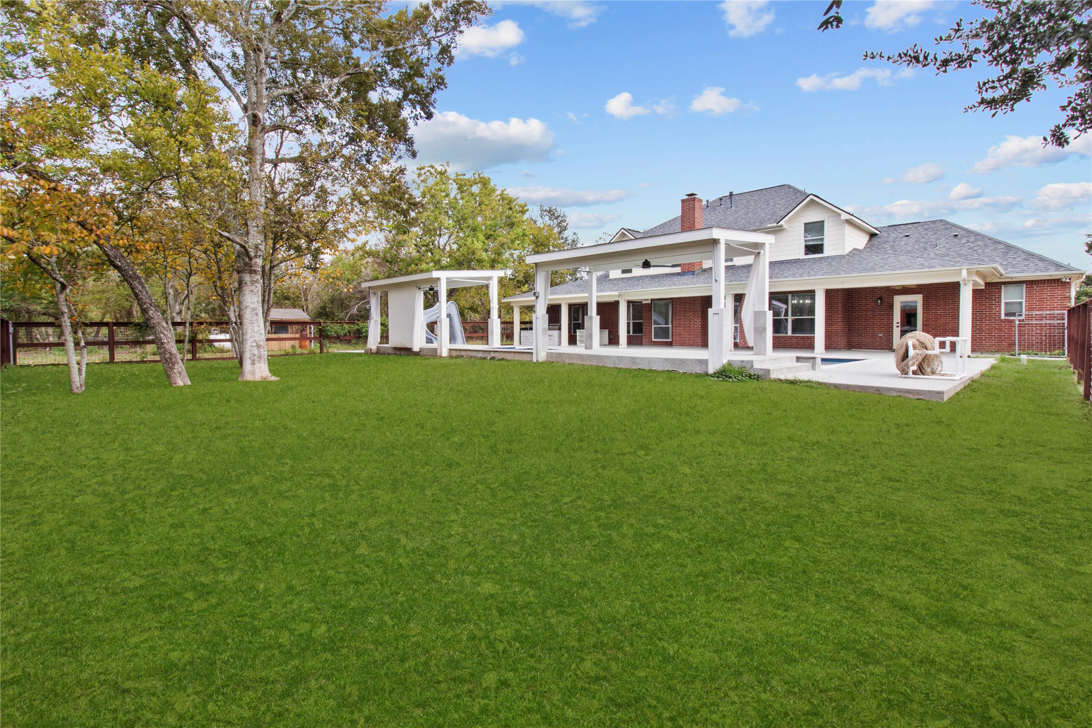 2730 Lawrence Road Kemah, TX 77565 - Photo 32 of 48 a front view of a house with a garden