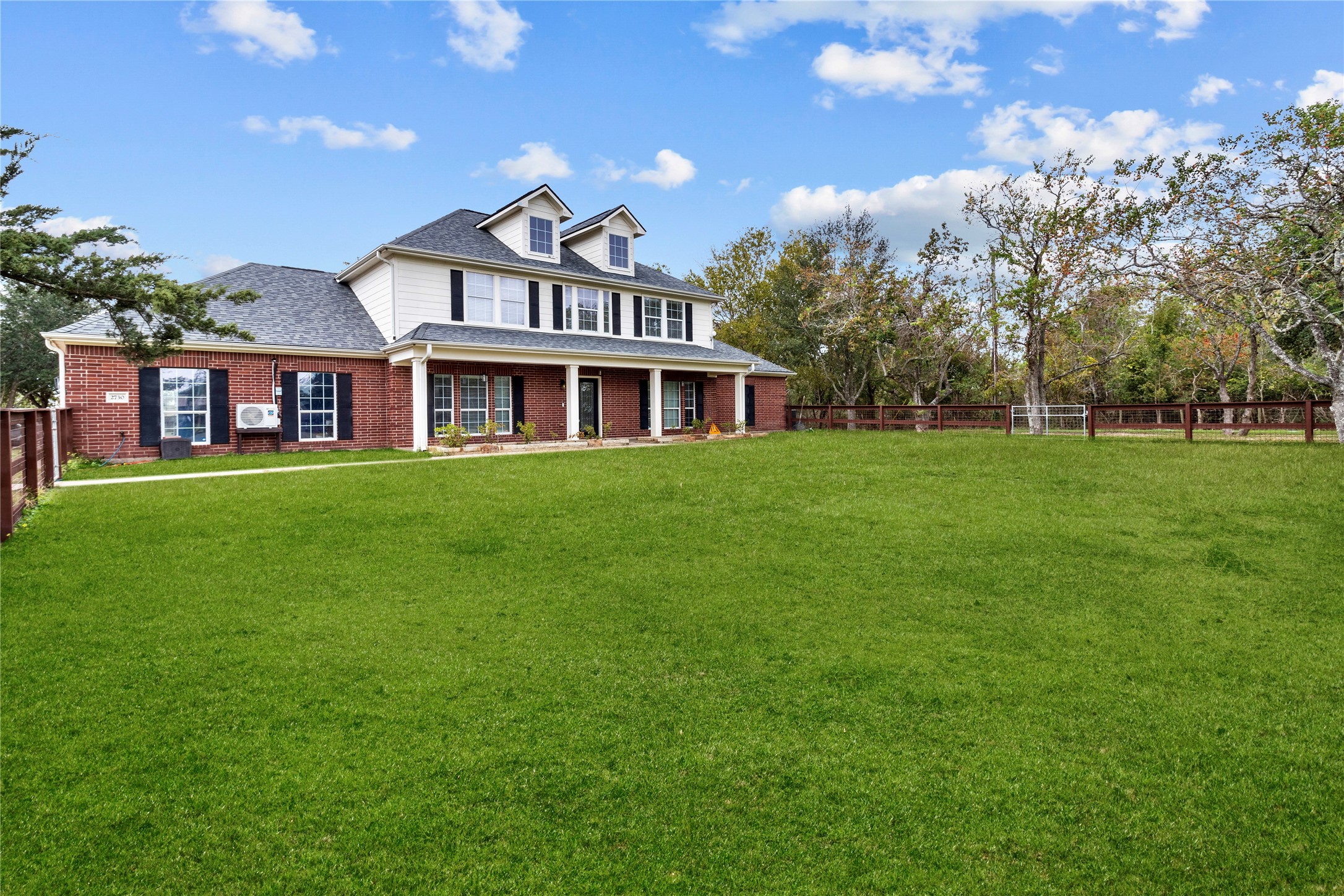 2730 Lawrence Road Kemah, TX 77565 - Photo 4 of 48 a front view of a house with a garden