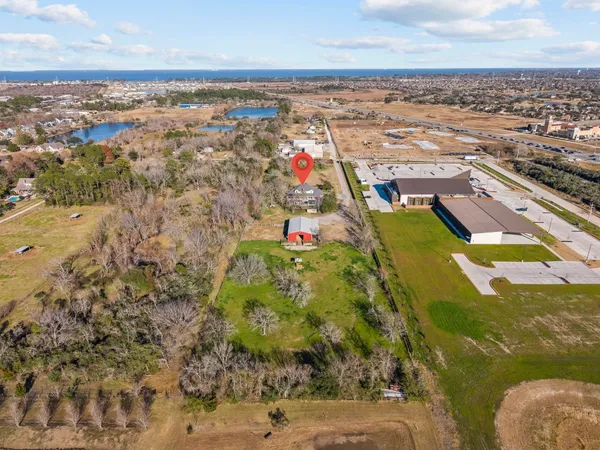 an aerial view of residential houses with outdoor space