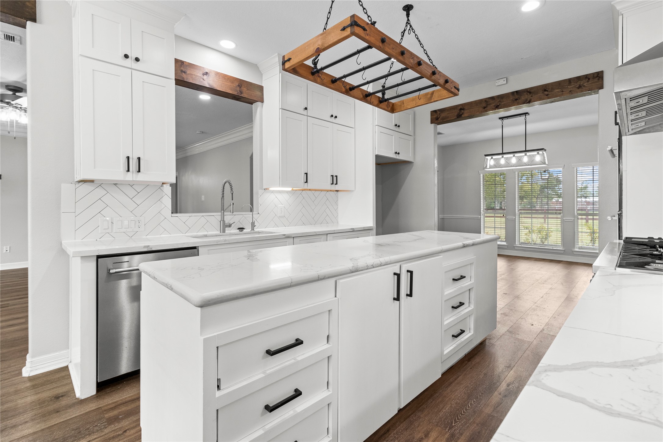 2730 Lawrence Road Kemah, TX 77565 - Photo 8 of 48 a kitchen with granite countertop a sink cabinets stainless steel appliances and a counter top space