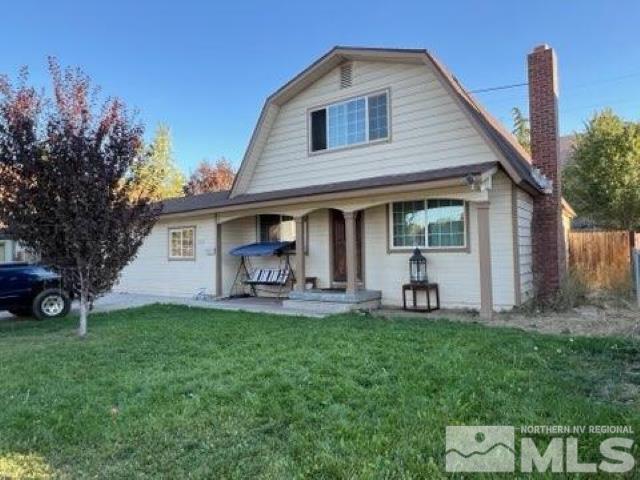 2500 Trident Way Reno, NV 89512 - Photo 2 of 5 a front view of house with a garden and trees