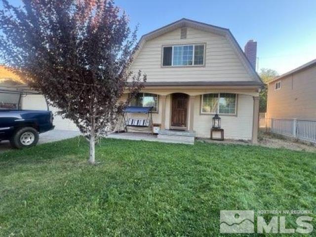 2500 Trident Way Reno, NV 89512 - Photo 3 of 5 a front view of a house with garden