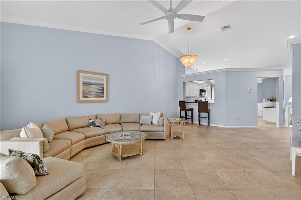 13061 Hamilton Harbour Drive, Unit R5 Naples, FL 34110 - Photo 11 of 39 a living room with furniture and kitchen view