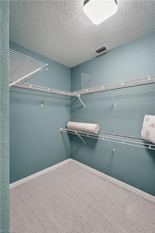 13061 Hamilton Harbour Drive, Unit R5 Naples, FL 34110 - Photo 23 of 39 a utility room with a washer and dryer