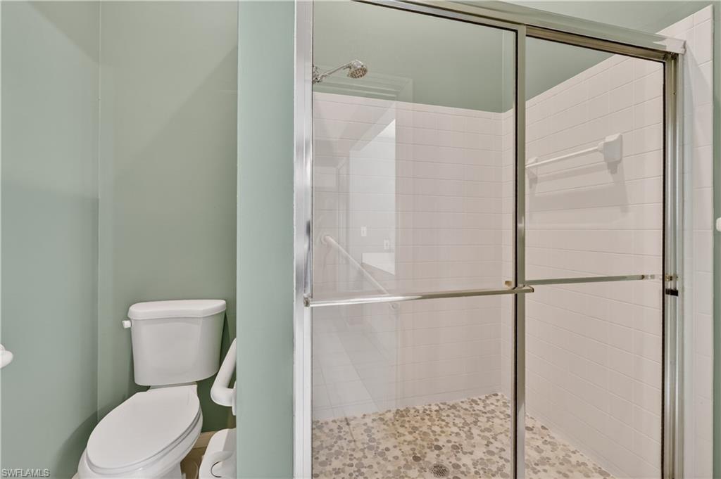 13061 Hamilton Harbour Drive, Unit R5 Naples, FL 34110 - Photo 25 of 39 a bathroom with a toilet and a shower