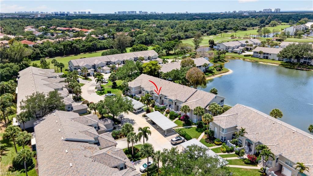 13061 Hamilton Harbour Drive, Unit R5 Naples, FL 34110 - Photo 33 of 39 an aerial view of a city with lots of residential buildings