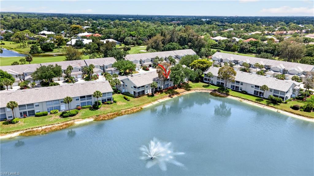 13061 Hamilton Harbour Drive, Unit R5 Naples, FL 34110 - Photo 34 of 39 an aerial view of residential houses with outdoor space and river