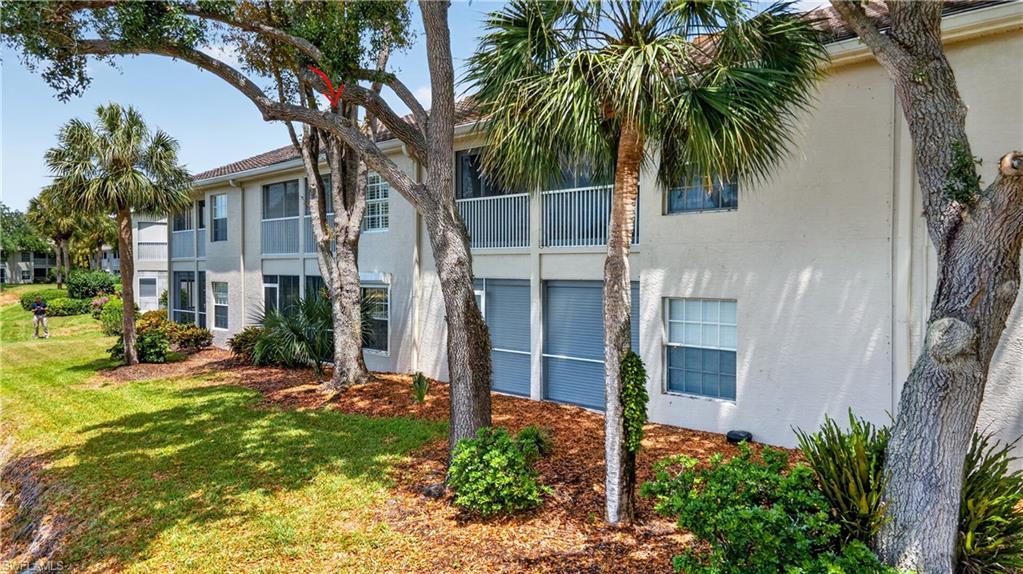 13061 Hamilton Harbour Drive, Unit R5 Naples, FL 34110 - Photo 35 of 39 a view of a house with a yard