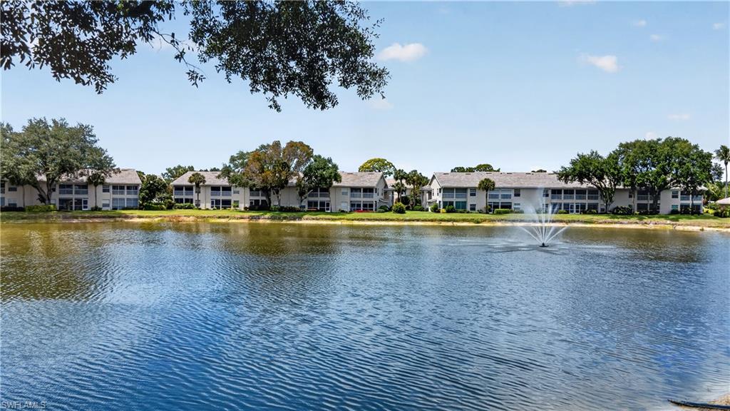 13061 Hamilton Harbour Drive, Unit R5 Naples, FL 34110 - Photo 36 of 39 a view of a swimming pool and an outdoor space