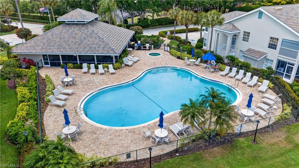 13061 Hamilton Harbour Drive, Unit R5 Naples, FL 34110 - Photo 37 of 39 an aerial view of a house with swimming pool garden and patio