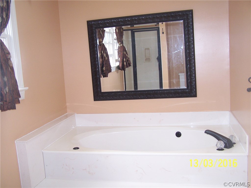 14011 Shadow Ridge Road Midlothian, VA 23112 - Photo 11 of 21 a bathroom with a tub and a sink