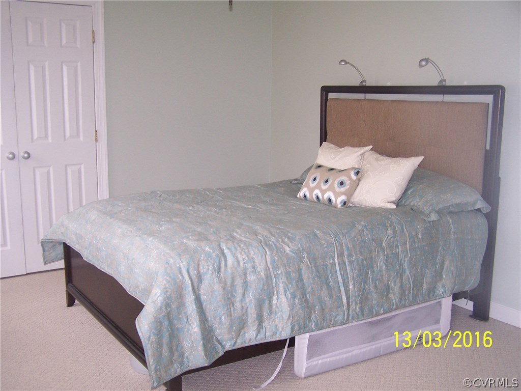 14011 Shadow Ridge Road Midlothian, VA 23112 - Photo 14 of 21 a bedroom with a bed and a night stand