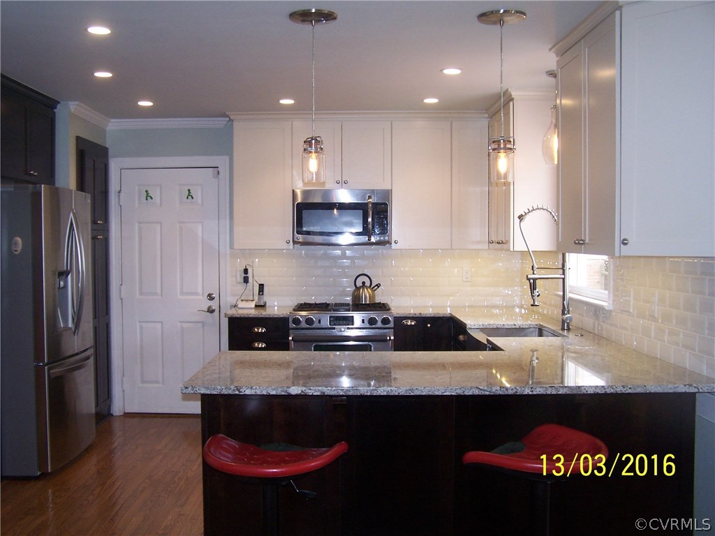 14011 Shadow Ridge Road Midlothian, VA 23112 - Photo 3 of 21 a kitchen with stainless steel appliances granite countertop a refrigerator a sink and a stove