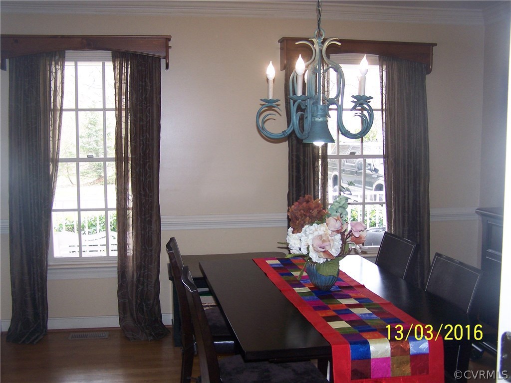 14011 Shadow Ridge Road Midlothian, VA 23112 - Photo 8 of 21 a view of a dining room with furniture window and wooden floor
