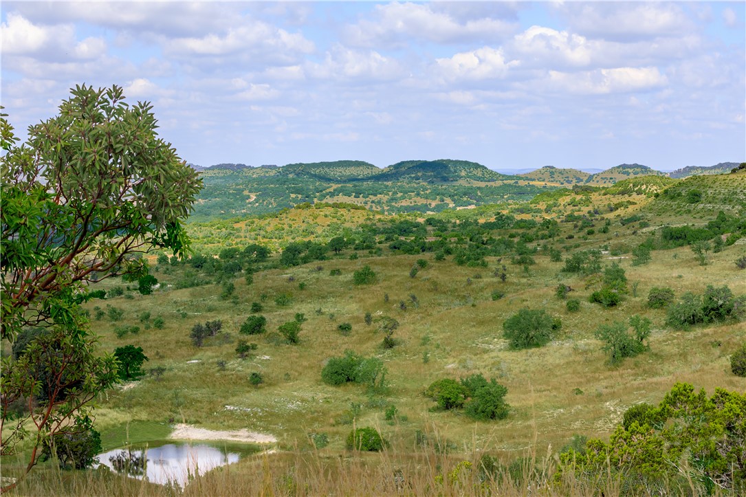 0 Brushy Ridge Trail Blanco, TX 78606 - Photo 12 of 27 a view of a lake with a building in background