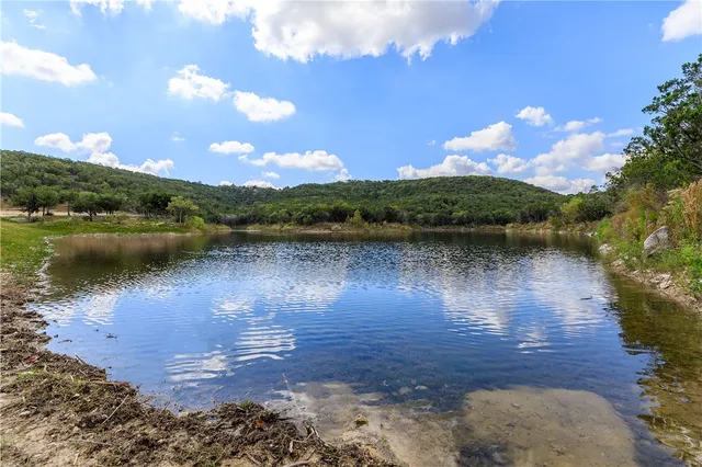 a view of a lake from a yard