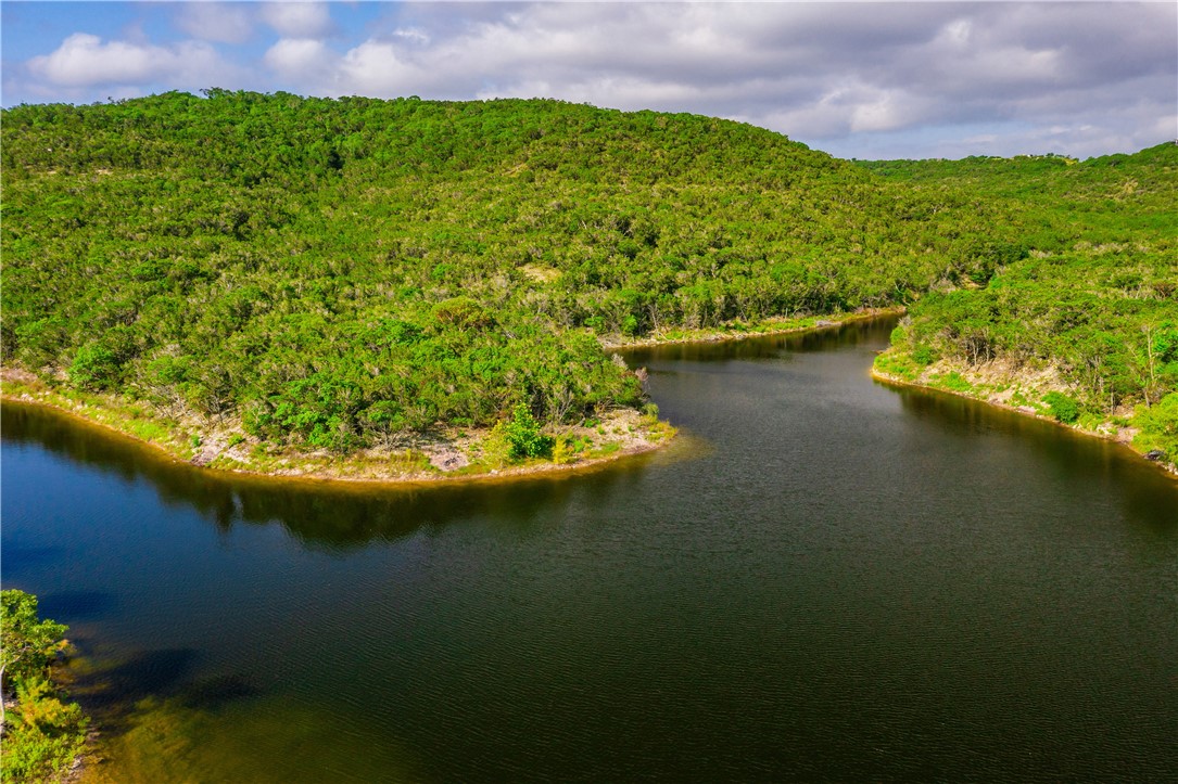 0 Brushy Ridge Trail Blanco, TX 78606 - Photo 2 of 27 a view of a lake with a house