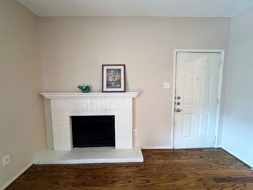4041 Drake Street, Unit 118 Houston, TX 77005 - Photo 5 of 22 a living room with a fireplace and a fireplace