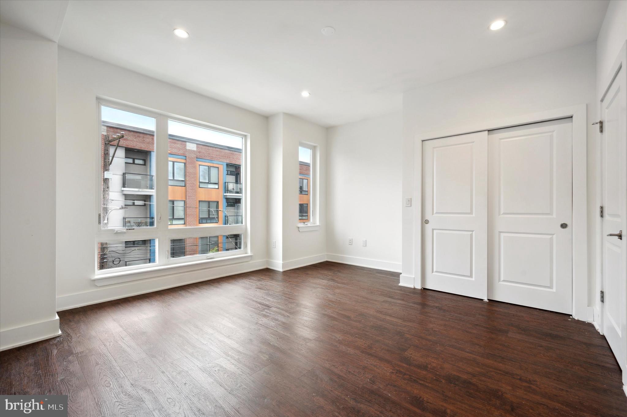 1219 North 5th Street, Unit 2 Philadelphia, PA 19122 - Photo 15 of 16 a view of empty room with wooden floor and fan